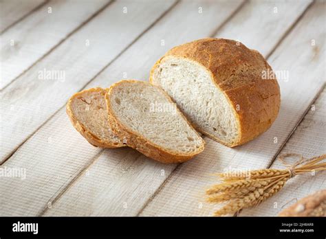 Fresh Baked Sliced Loaf Of Bread With Wheat Stock Photo Alamy