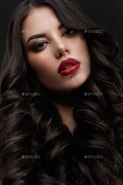 Beautiful Brunette Model Curls Classic Makeup And Red Lips The Beauty Face Stock Photo By
