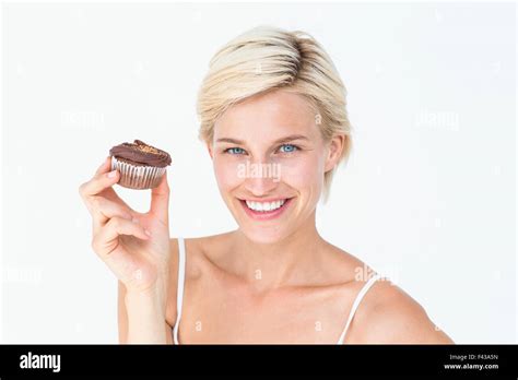 Pretty Blonde Holding Chocolate Muffin Stock Photo Alamy