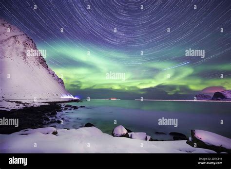 Northern Lights And Stars And Startrails With Milky Way At Night In The