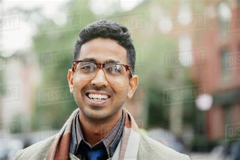 Indian Man Smiling In City Stock Photo Dissolve