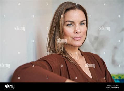Attractive Brunette Mature Woman Sitting Hi Res Stock Photography And