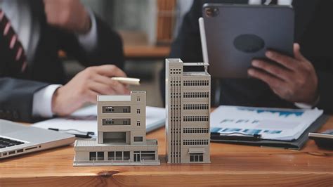 Discussion With A Real Estate Agent House Model With Agent And