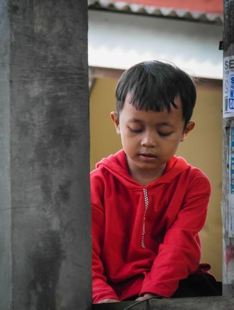 Premium Photo Portrait Of Boy Looking Through Window