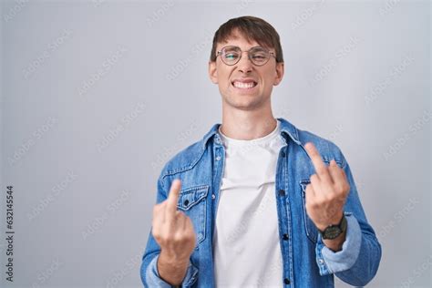 Stock Foto Caucasian Blond Man Standing Wearing Glasses Showing Middle Finger Doing Fuck You