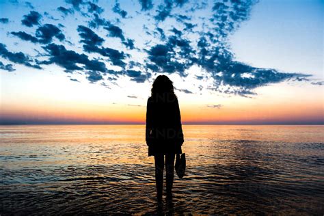 Female Silhouette Standing Back