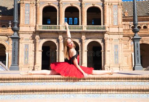 Classical Ballet Dancer And Lesbian Leaning On A Railing In A Park