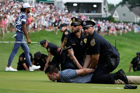 Climate protesters storm 18th green before Scottie Scheffler wins
