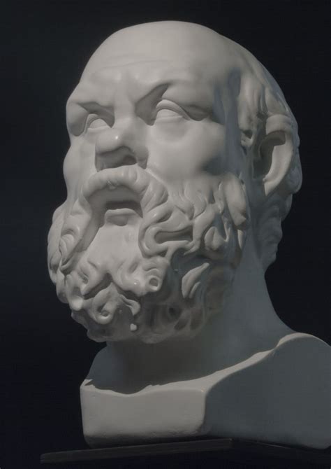 A White Marble Bust Of A Man With Long Hair And Beard