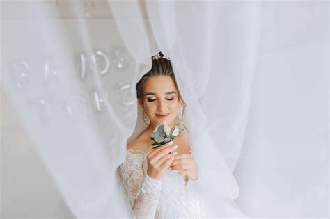 Premium Photo A Brunette Bride In A White Dress Holds Her Wedding Bouquet Poses French