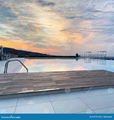 Stunning View of a Pool Reflecting the Mesmerizing Sunset Stock Photo ...