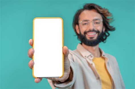 Premium Photo Cheerful Man Showing Smartphone With Big Blank White