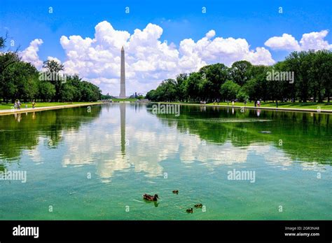 Reflections Of The Washington Monument In The Reflecting Pool