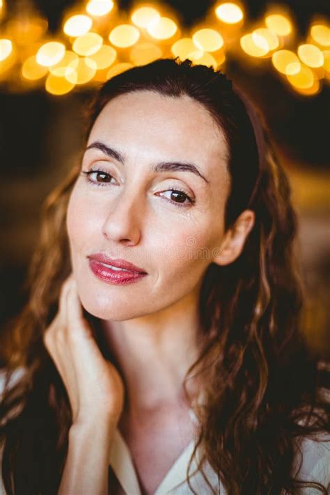 Close Up Of Pretty Brunette With Hand Under Her Chin Looking At Camera Stock Photo Image Of