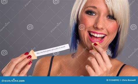 Pretty Blonde Woman Eats Fortune Cookie Showing Message Stock Photo Image Of Expression