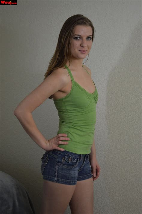 Lovely Brunette Girl Showing Off Her Nice Butt In Shorts Photos