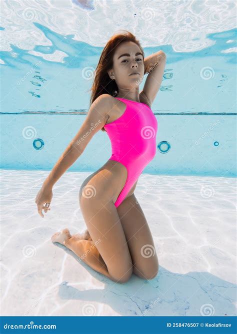 Attractive Woman In Pink Bikini Posing Underwater In Pool Glamour Portrait Stock Image Image
