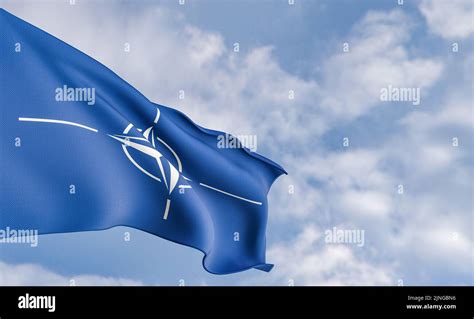 Organization Flag Nato On The Background Of Clouds Fabric Flag Nato