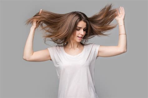 Premium Photo Portrait Of Beautiful Brunette Woman With Natural Makeup On Grey Background