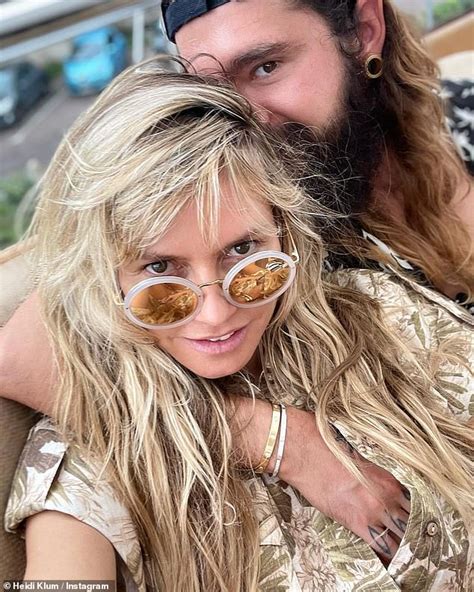 Heidi Klum Drops Jaws In Tiny Purple Bikini Before Cosying Up To