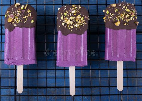 Bilberry Ice Cream Decorated With Chocolate And Pistachio Nuts Stock