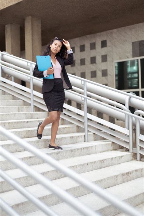 Adult Latina Woman Wearing Sunglasses And Sombrero Walks The Historic Streets Of Acapulco