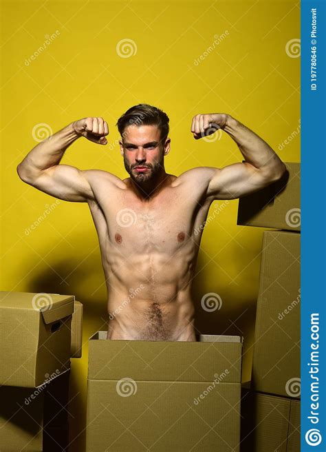 Guy With Muscular Stands Naked Among Boxes Stock Photo Image Of Bristle Demonstrate