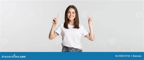 Attractive Smiling Brunette Girl Pointing Fingers Up Showing Logo Stock Image Image Of