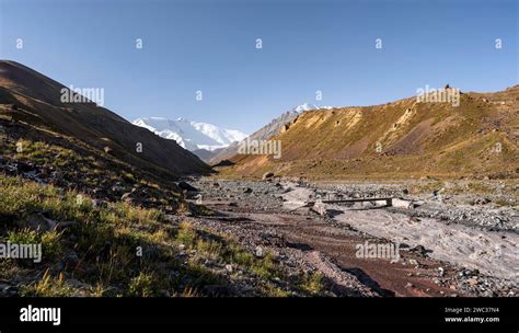 Bridge over the river Achik Tash, Achik Tash valley, behind glaciated ...