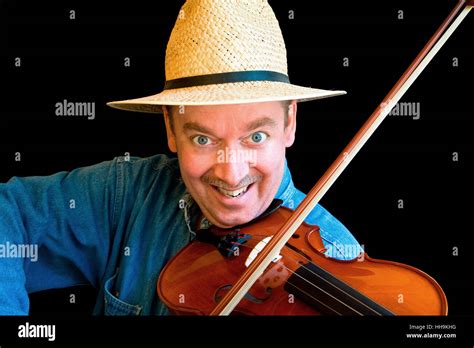 A man is playing country music on the fiddle Stock Photo - Alamy