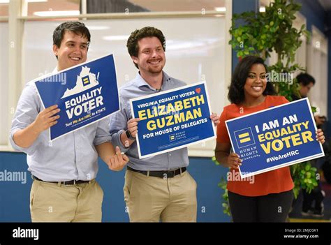 From Left Rob Silverstein Keith Brannum And Ivana Hall Hold Signs During A News Conference To