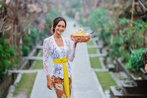 Beauty Of Balinese Woman Smiling To Camera Standing In Bali Village