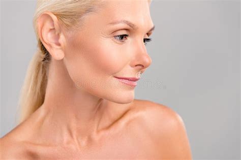 Photo Of Sweet Adorable Senior Lady Nude Shoulders Looking Empty Space Isolated Grey Color