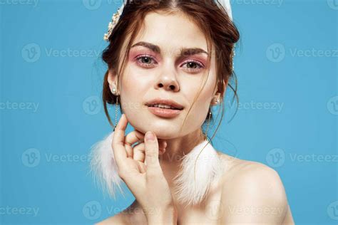 Attractive Woman Naked Shoulders Fluffy Earrings Cosmetics Blue Background 23757367 Stock Photo