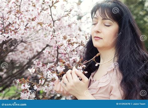 Brunette Woman In Spring Flowers Garden Stock Photo Image Of Brunette