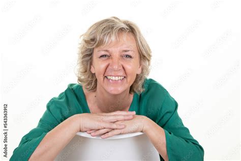 Beautiful Mature Woman Senior Blond Sitting Over White Background Stock Photo Adobe Stock
