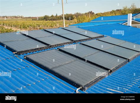 Solar water heating system on the house roof Stock Photo - Alamy