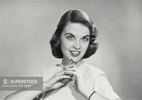 Vintage Photograph Brunette Woman With Hands Clasped In Front Of Chin Superstock