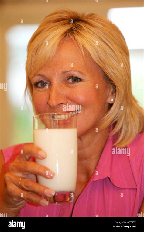 Mature Woman Drinking Milk Model Released Stock Photo Alamy
