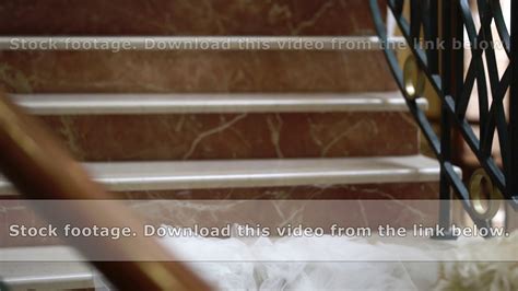 Beautiful woman in dress with naked back on stairs - YouTube