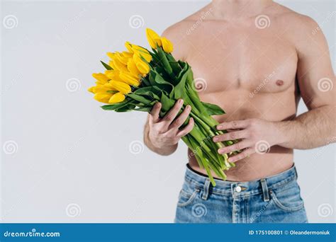Man Man With Naked Torso Gives Flowers Romantic Man With Bouquet Of Tulips For Birthday Happy