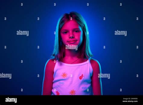 Portrait Of Young 9 Years Old Girl With Brown Hair In Pink Polo Shirt