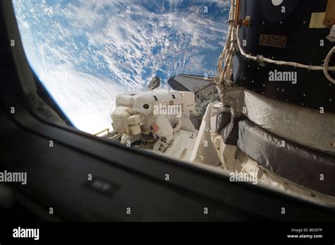 Astronaut Participating In Extravehicular Activity Stock Photo Alamy