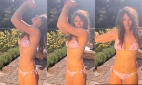 Liz Hurley s boobs escape from tiny string bikini in sizzling beach exposé Daily Star