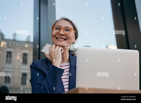 Mature Asian Computer Hi Res Stock Photography And Images Alamy