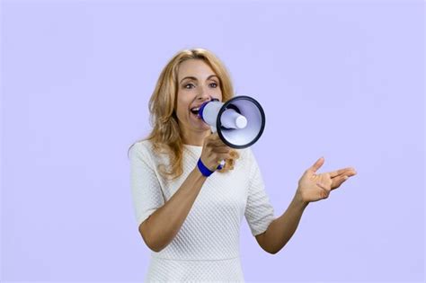 Premium Photo Happy Positive Blonde Woman Giving A Speech In Megaphone Isolated On Purple