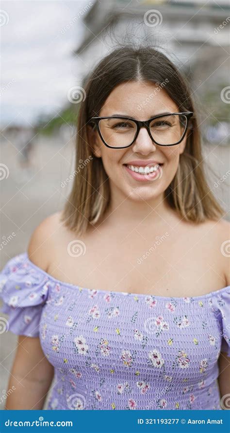 Cheerful Latin Beauty In Glasses A Brunette Woman Poses With A Confident And Carefree Smile At