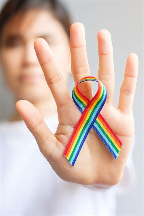 Hand Holding Lgbtq Rainbow Ribbon For Support Lesbian Gay Bisexual Transgender And Community