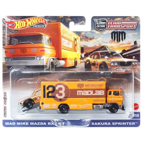 Hot Wheels Team Transport Fahrzeuge Truck mit Anhänger und Race Car Mad Mike Mazda RX3 GT
