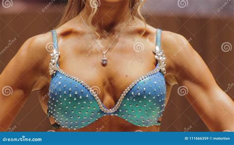 Breasts Of Fitness Model Performing At Bodybuilding Contest In Sparkling Bikini Stock Video